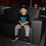 Youth tee worn by child: black shirt with blue “DIRT BIKE KIDZ” front graphic