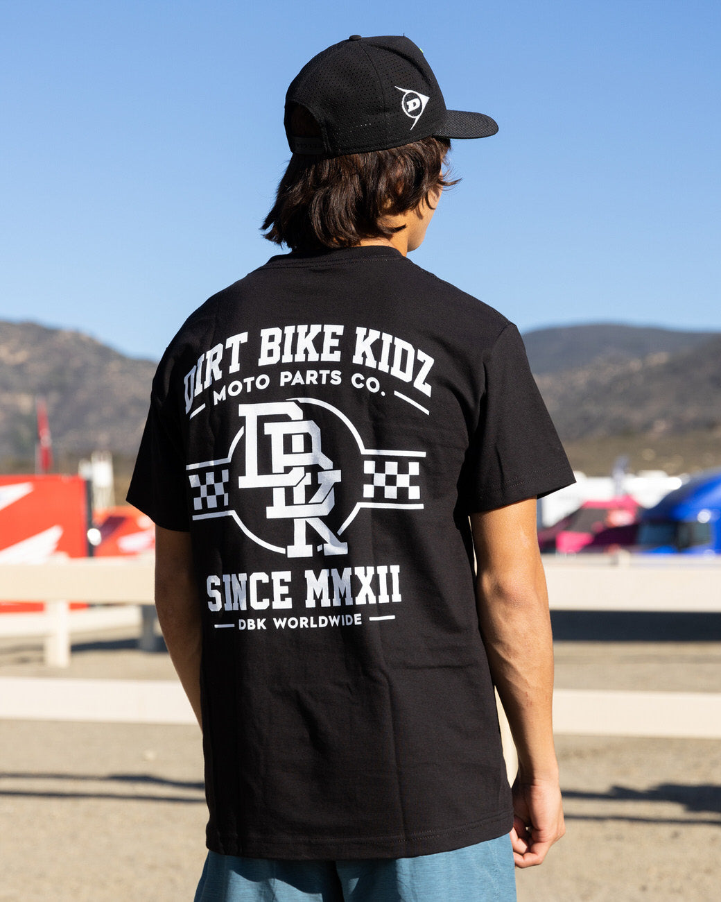 Black Hot Rod T-shirt with large back “DIRT BIKE KIDZ” print worn by model