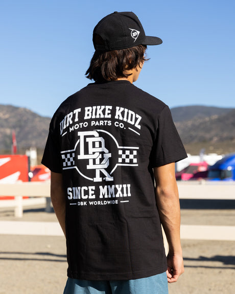Black Hot Rod T-shirt with large back “DIRT BIKE KIDZ” print worn by model