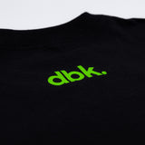 Youth black T-shirt fabric close-up with green dbk. logo