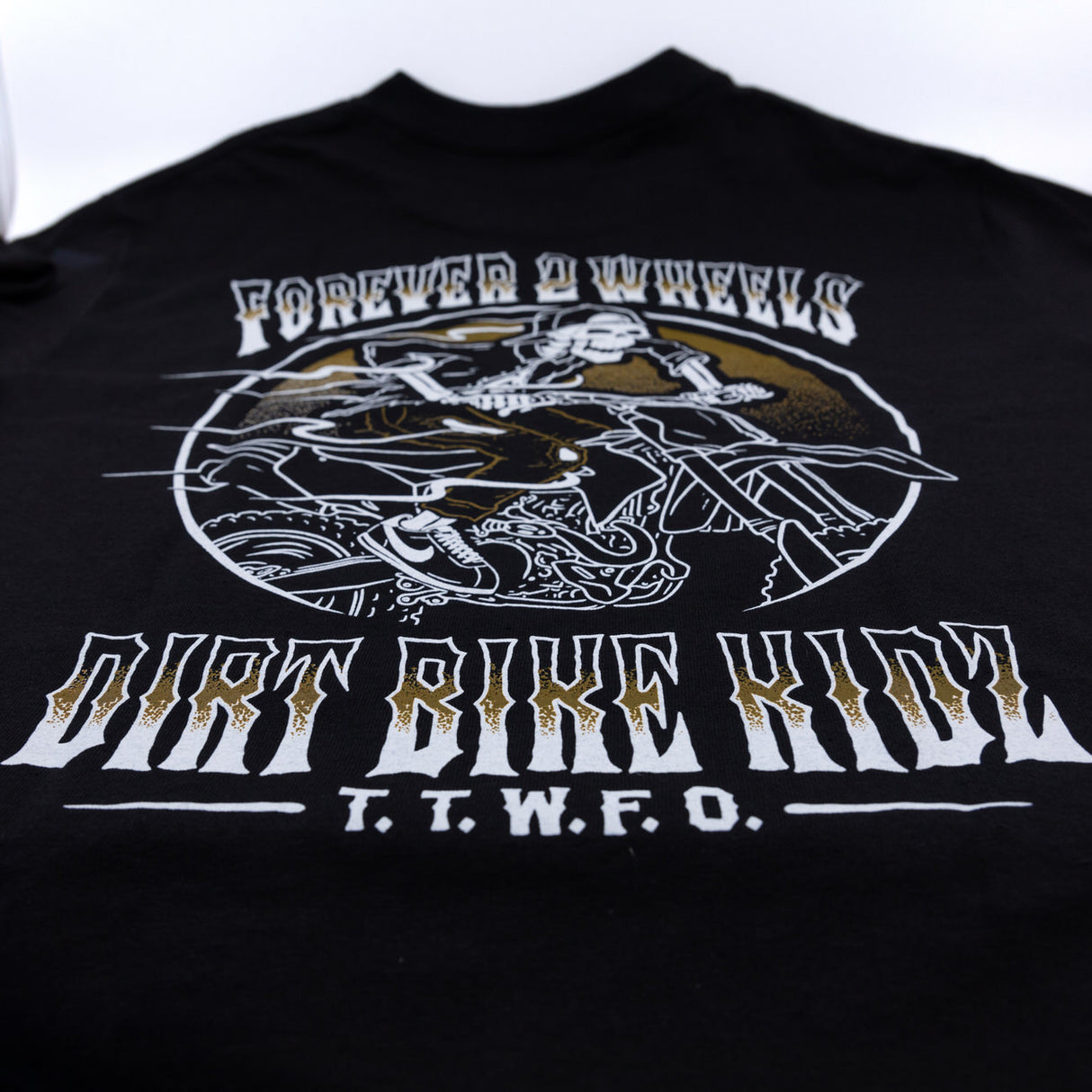 Black T-shirt close-up of large back wheel rider graphic and title text