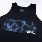 Close-up of black tank top chest panel with blue tie-dye band and dbk logo