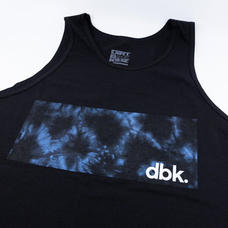 Close-up of black tank top chest panel with blue tie-dye band and dbk logo