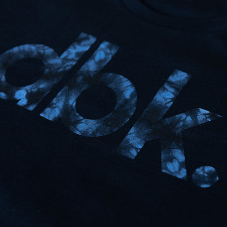 Youth black crewneck T-shirt with cropped blue tie-dye logo lettering
