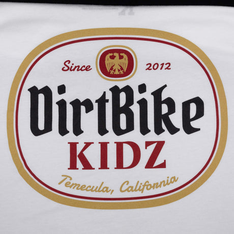 Premium tall tee logo close-up, white fabric with DirtBike KIDZ oval graphic