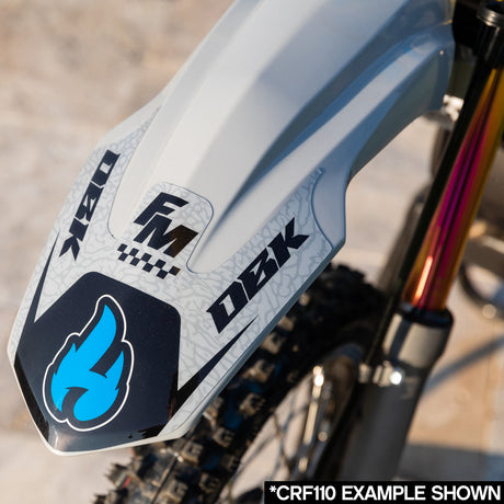 KLX 110 side panel decal in light gray with blue graphics and “FM” logo