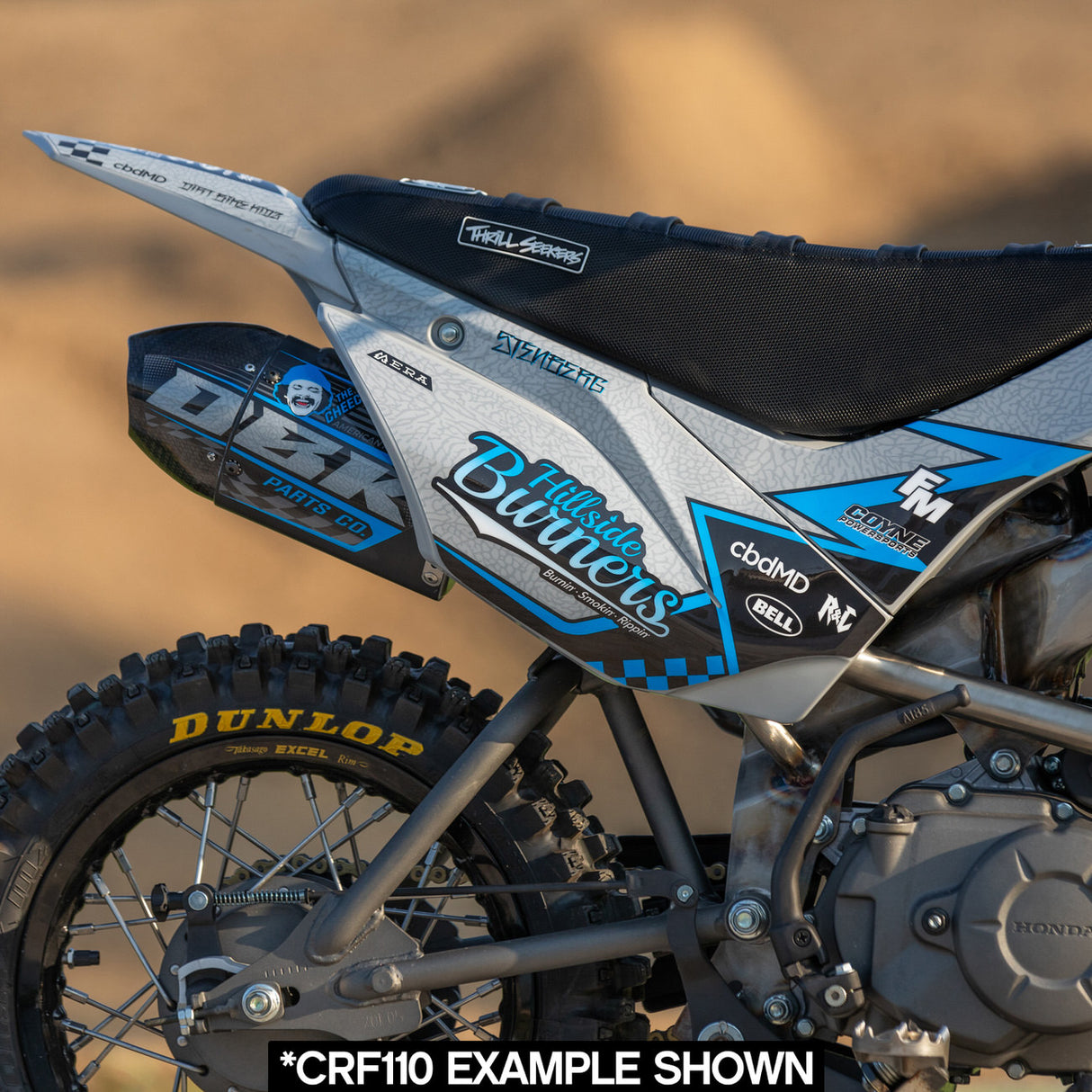Side panel close-up: Hillside Burners blue/gray graphics with rider seat and rear fender
