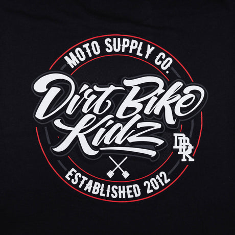 Close-up of Moto Supply Co. circular graphic on black tall tee