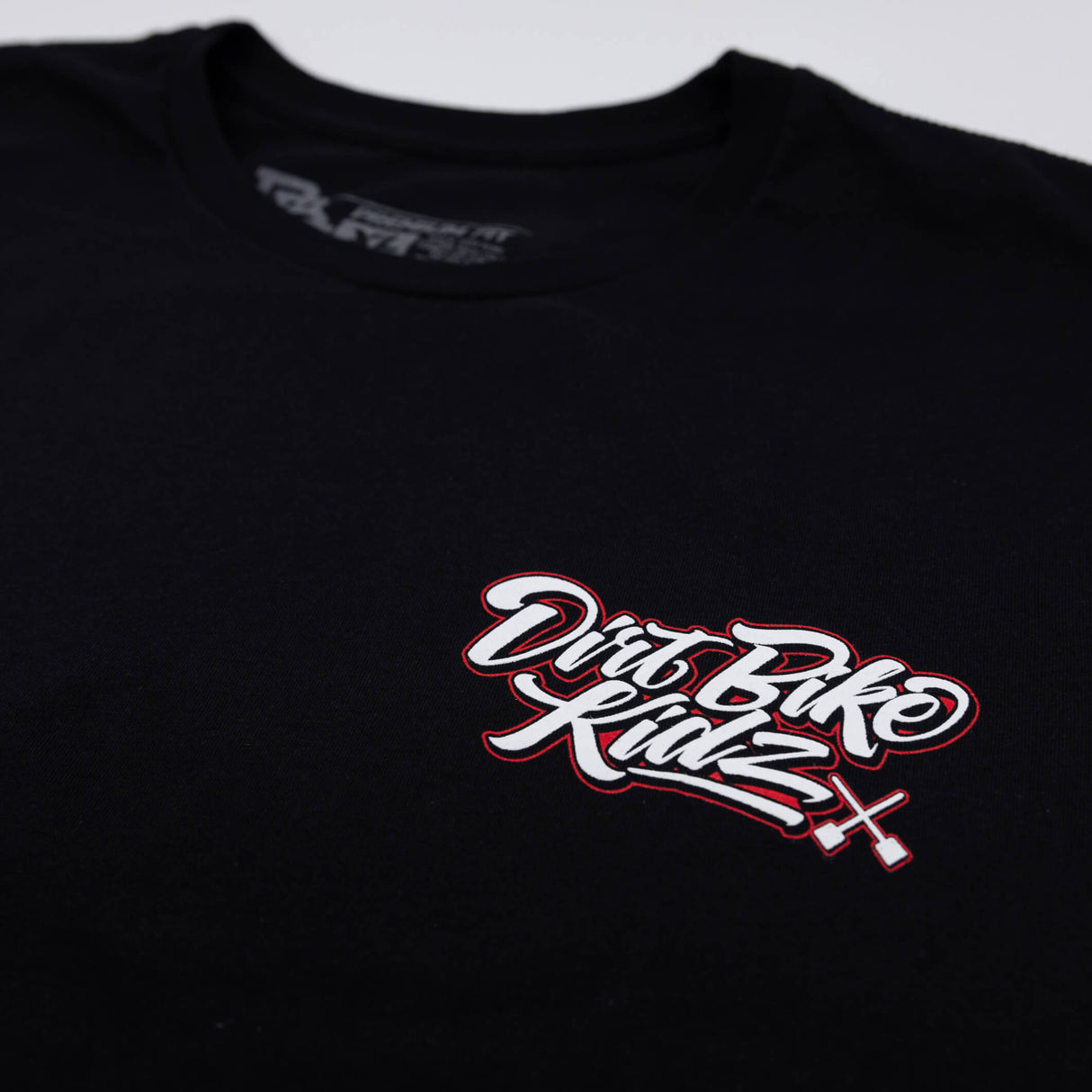 Black youth premium tee close-up of Drift Bike Kidz front logo.