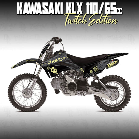 Kawasaki KLX 110 dirt bike with black and yellow faded graphic decals, off-road wheels