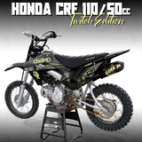 Honda CRF 110/50 graphics kit on black dirt bike with yellow accents, angled view