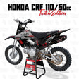 Dirt bike graphics on a black-and-silver motocross motorcycle with red accents and knobby tires