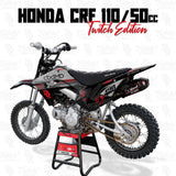 Dirt bike graphics on a black-and-silver motocross motorcycle with red accents and knobby tires
