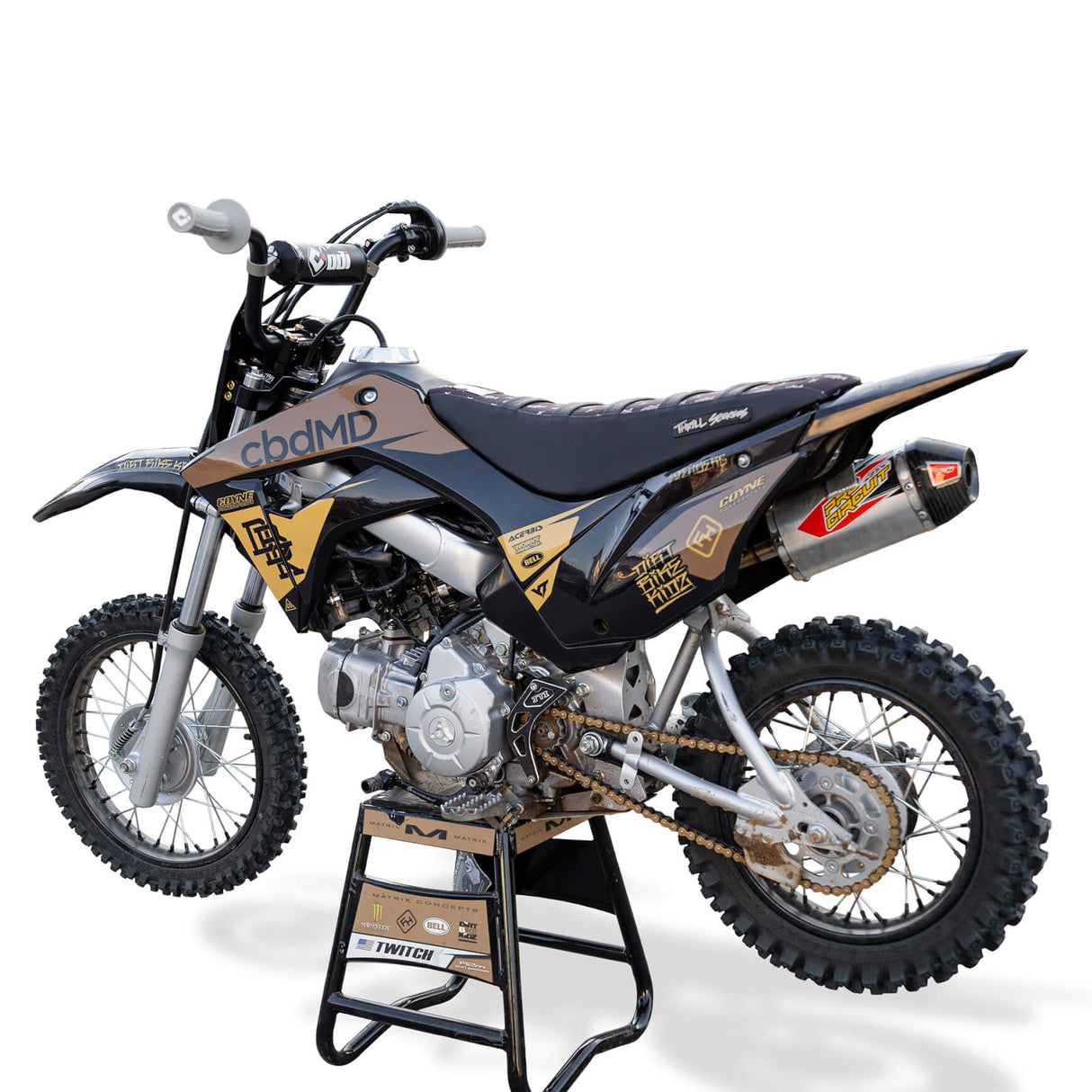 Honda CRF 110 dirt bike in black and silver with racing graphics, knobby tires