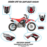 Motorcycle side panel kit in gray and red with black-and-red flame graphic