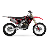Off-road motorcycle graphic kit on black and red bike, gold fork, white wheels