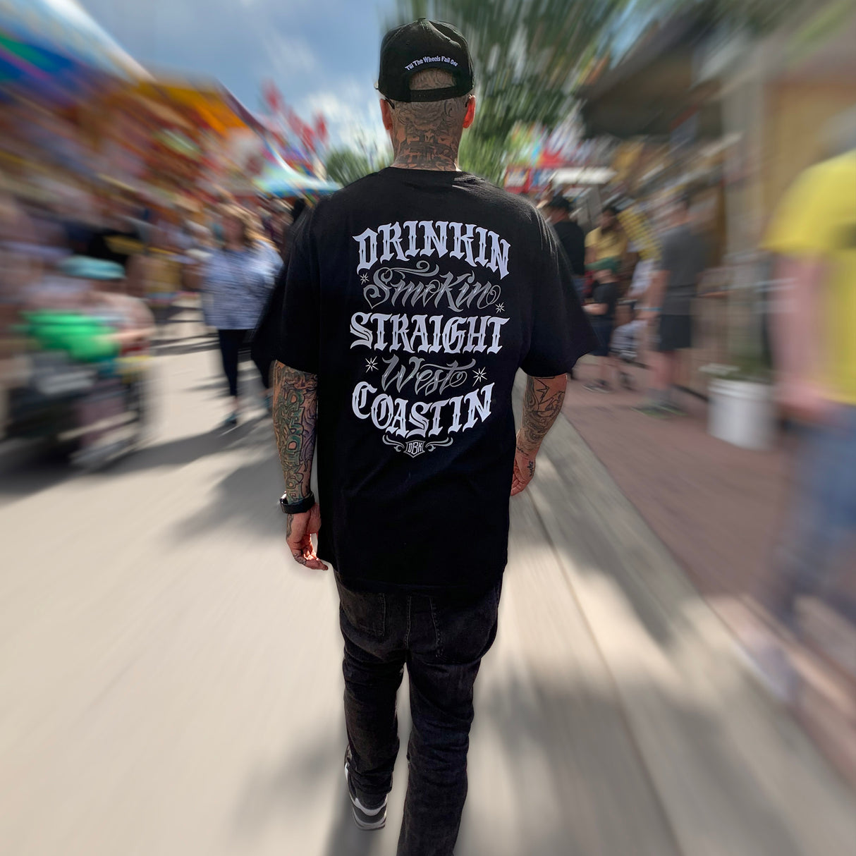 Black graphic T-shirt with back print, worn by model