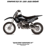 Black and gray KLX 110 motorcycle graphic kit with decals on fenders and side panels