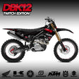 Moto bike with black and red body graphics, knobby tires, and gold front fork