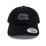 Black dad hat with dbk logo embroidery and adjustable front label