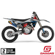 GasGas motocross dirt bike, left-side view with blue/gray graphics and knobby tires