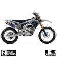 Off-road motorcycle with blue/black/white panels and knobby tires