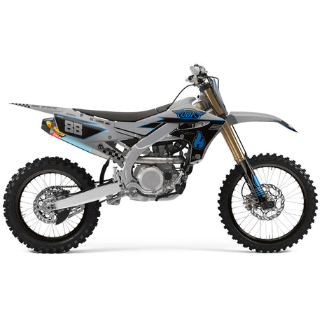 Off-road motorcycle with blue/black graphics, number 88, silver frame, knobby tires