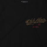 Slugger T-shirt logo close-up: Dbk Moto script with “12” and Southern California