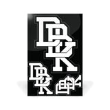 Sticker pack sheet with multiple stacked white block-letter decals on dark background